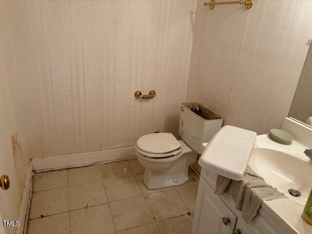 809 Simmons Street Durham, NC 27701 - Photo 14 of 16 a white toilet sitting next to a bathroom sink