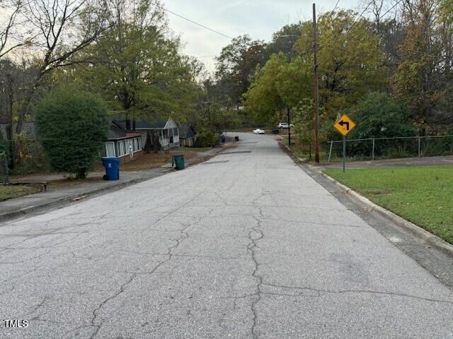809 Simmons Street Durham, NC 27701 - Photo 5 of 16 a view of outdoor space with deck and yard