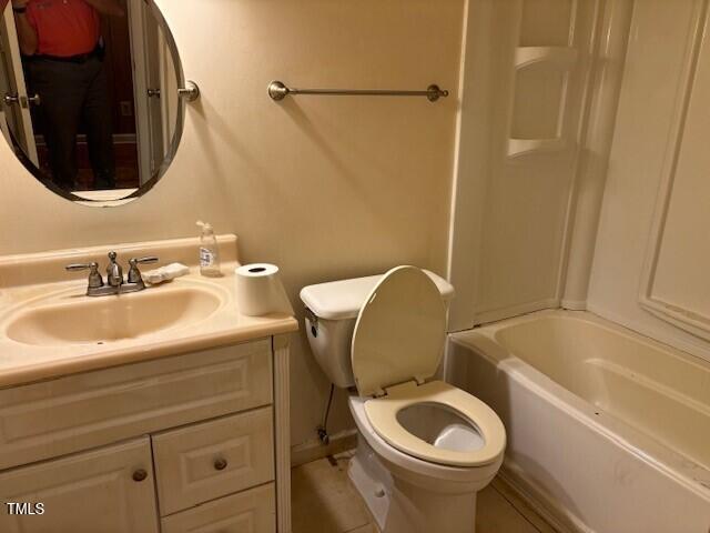 809 Simmons Street Durham, NC 27701 - Photo 9 of 16 a bathroom with a toilet sink and mirror