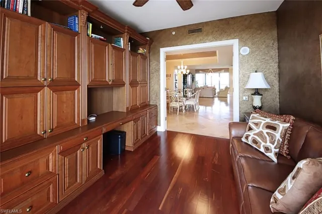 a bedroom with a bed and a lamp next to a window