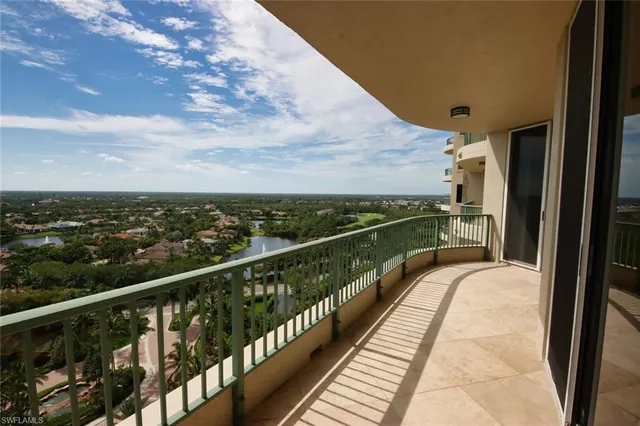 an aerial view of residential houses with city view