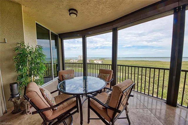 a view of a city from a dining room with furniture window and outside view