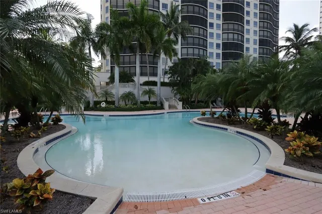 a view of a swimming pool with a patio