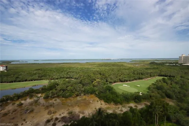 a living room with furniture ceiling fan and a window