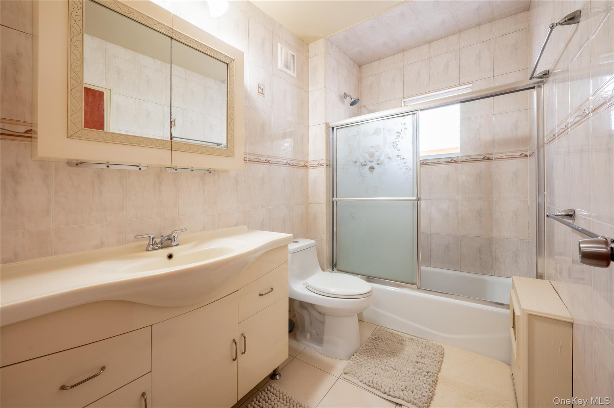 104-48 Lefferts Boulevard Queens, NY 11419 - Photo 16 of 22 a bathroom with a sink a toilet and shower