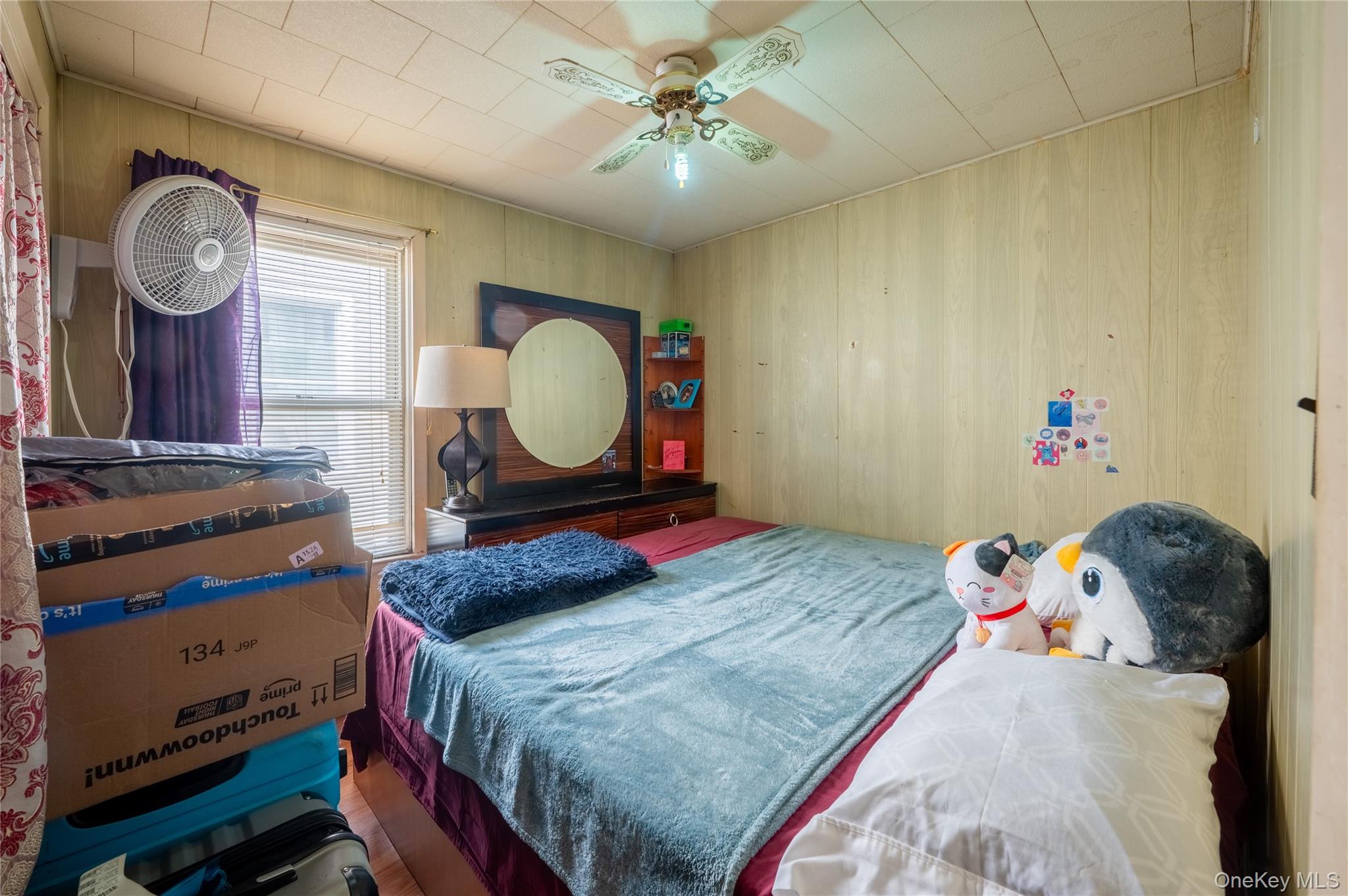 104-48 Lefferts Boulevard Queens, NY 11419 - Photo 17 of 22 a bed room with a bed and a closet