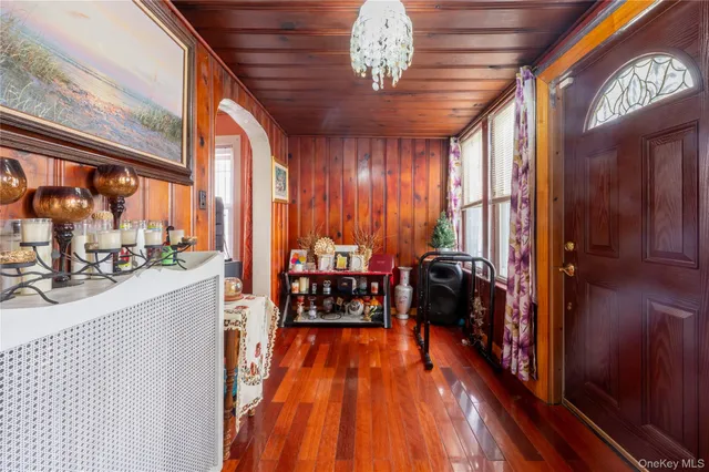 a view of a room with furniture and wooden floor