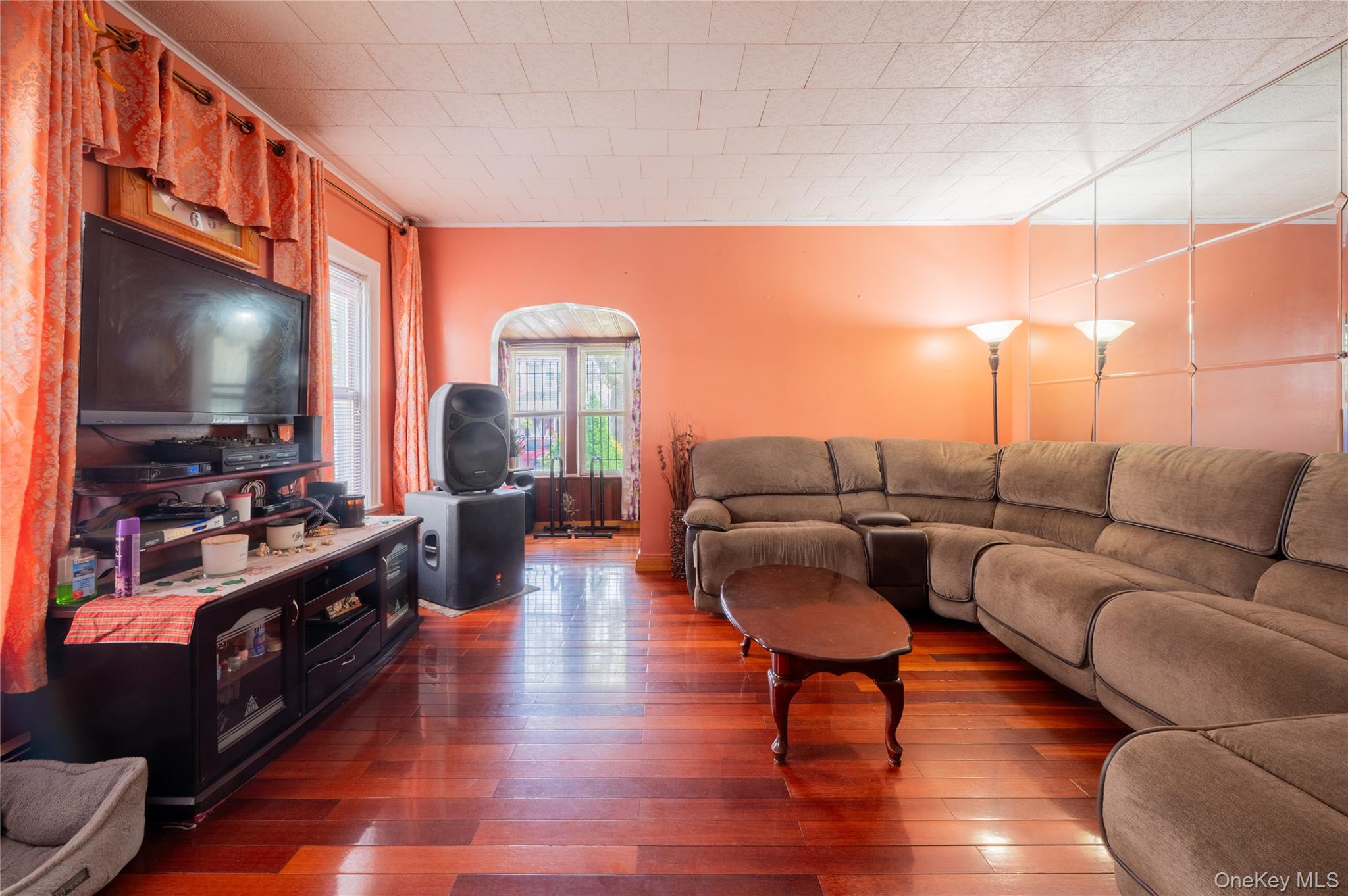 104-48 Lefferts Boulevard Queens, NY 11419 - Photo 5 of 22 a living room with furniture and a flat screen tv