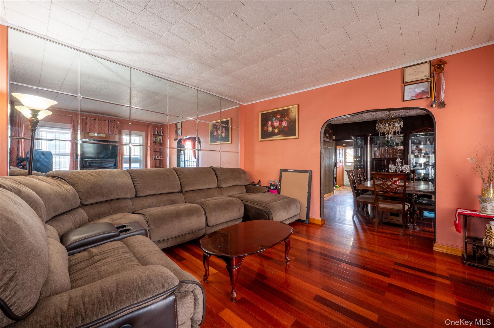 104-48 Lefferts Boulevard Queens, NY 11419 - Photo 6 of 22 a living room with furniture and wooden floor
