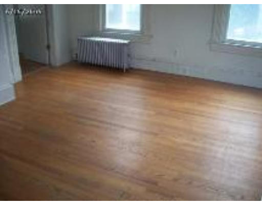 66 Palmer Avenue Springfield, MA 01108 - Photo 4 of 8 a view of a room with clothes and window