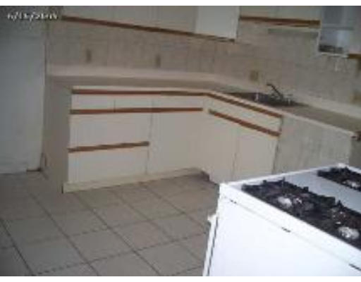66 Palmer Avenue Springfield, MA 01108 - Photo 5 of 8 a kitchen with a sink and cabinets