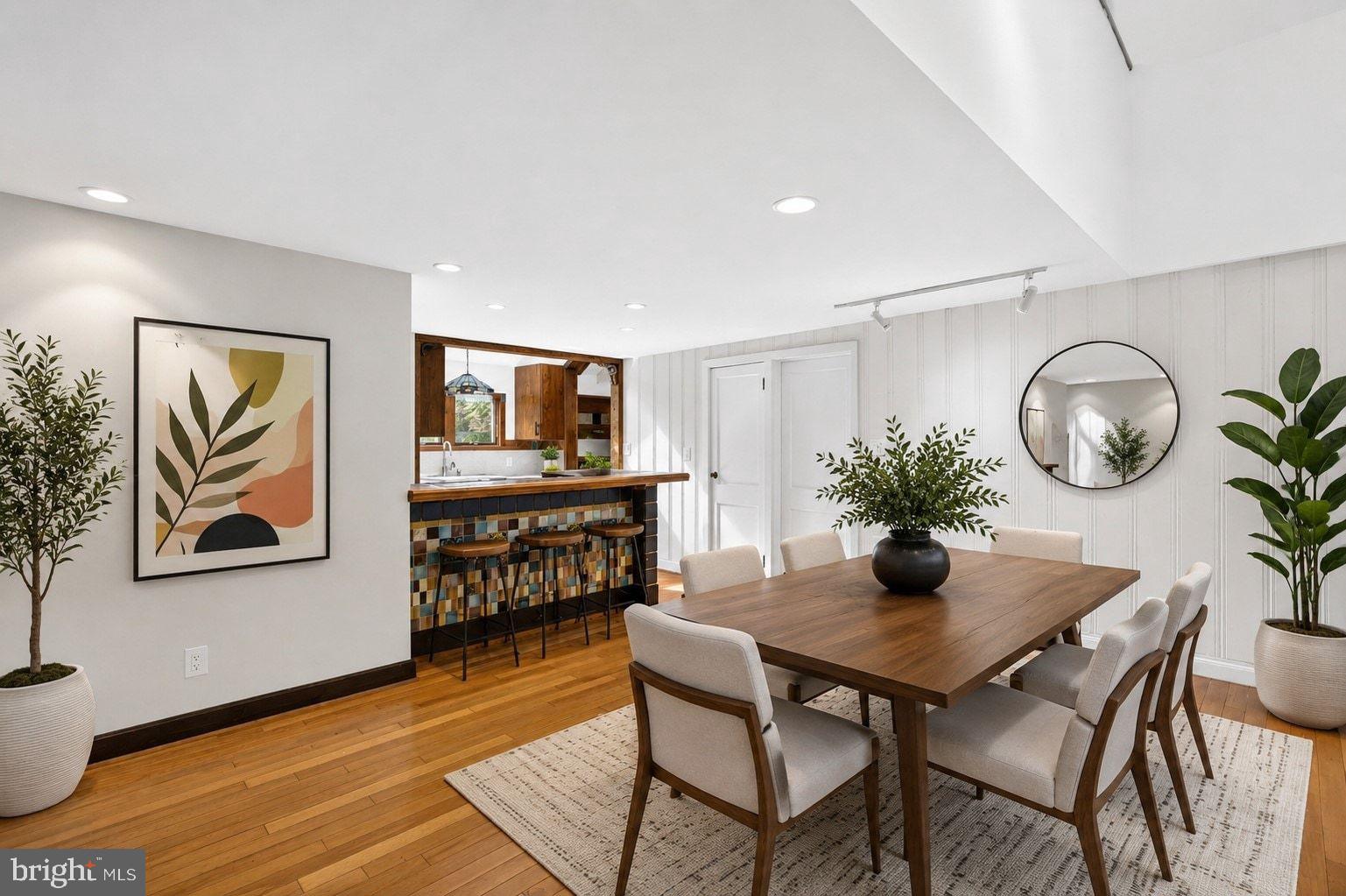 498 Perrineville Road Robbinsville, NJ 08691 - Photo 8 of 59 a view of a dining room with furniture and wooden floor