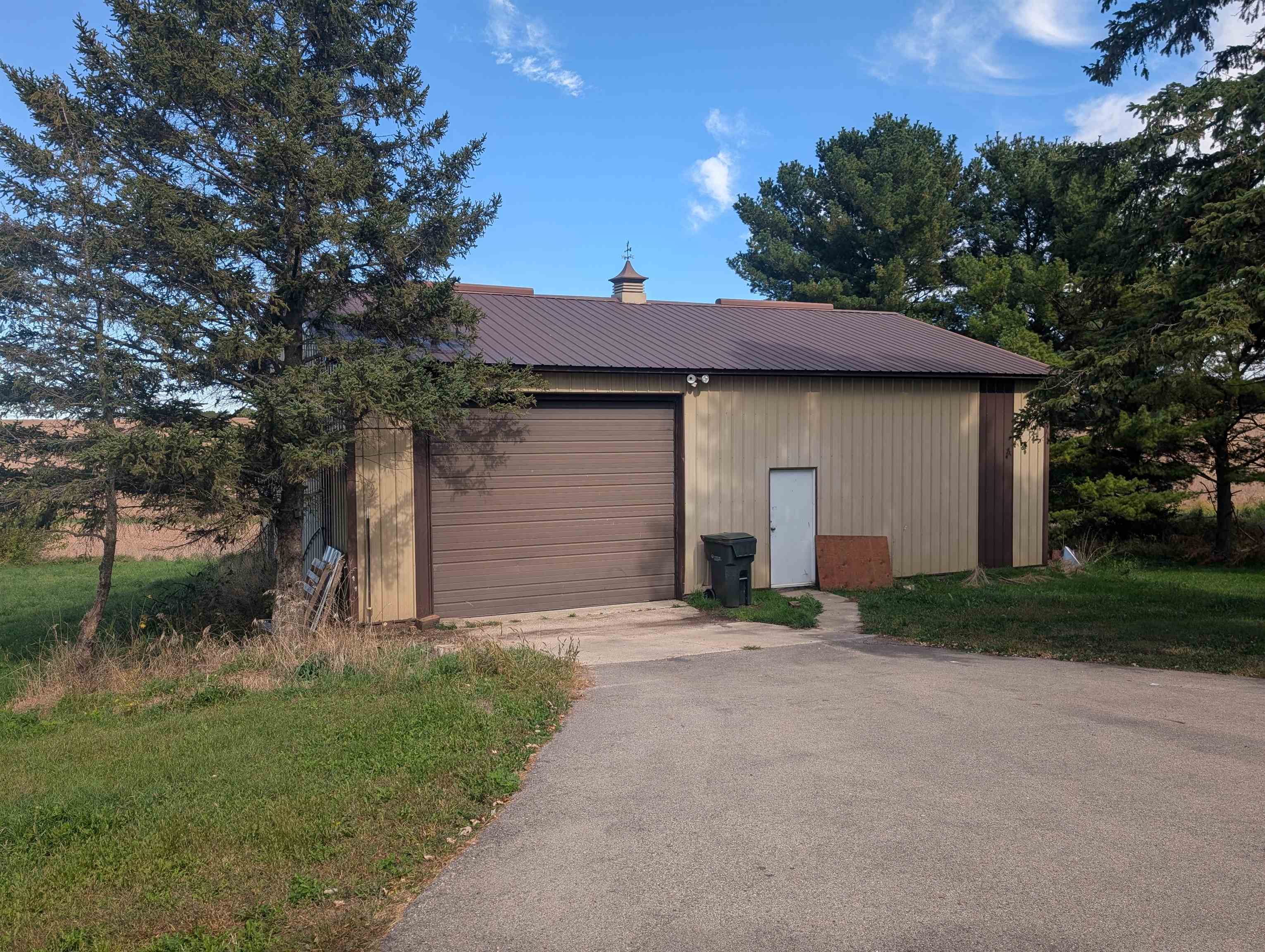 10740 North Barker Road Byron, IL 61010 - Photo 15 of 21 a front view of a house with a yard and garage