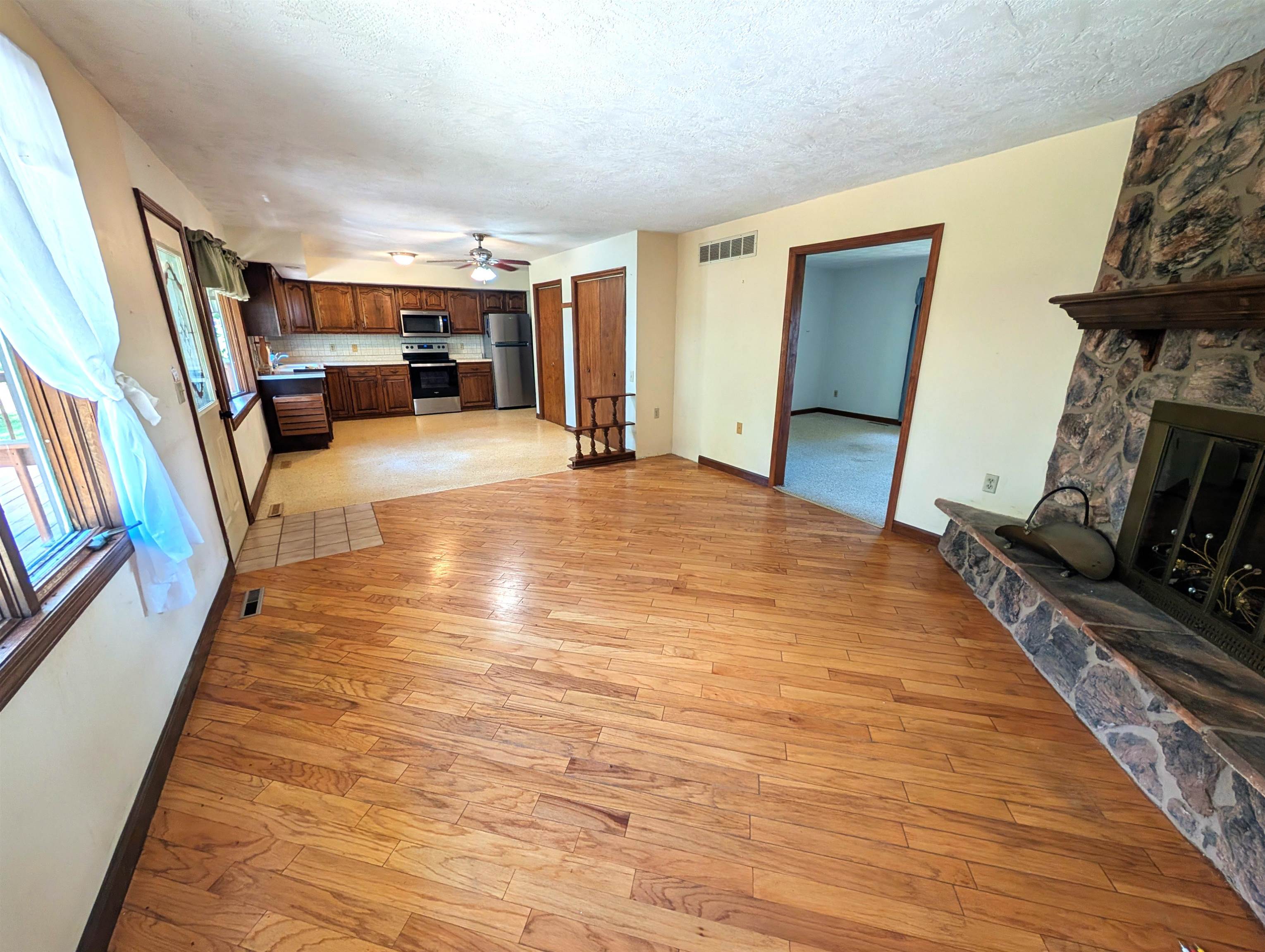 10740 North Barker Road Byron, IL 61010 - Photo 4 of 21 a bedroom with furniture and a fireplace