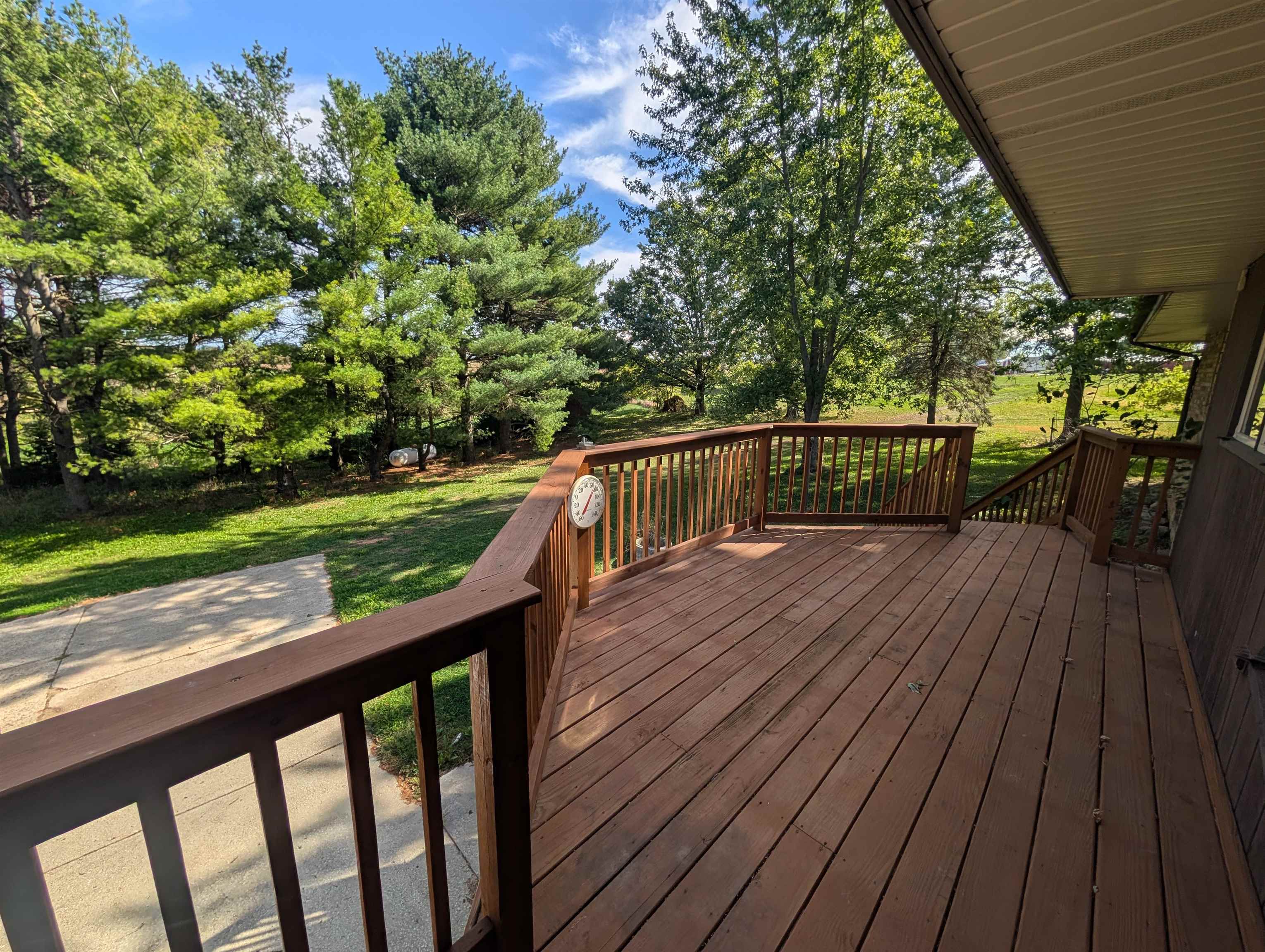 10740 North Barker Road Byron, IL 61010 - Photo 7 of 21 a view of balcony with wooden floor and outdoor seating