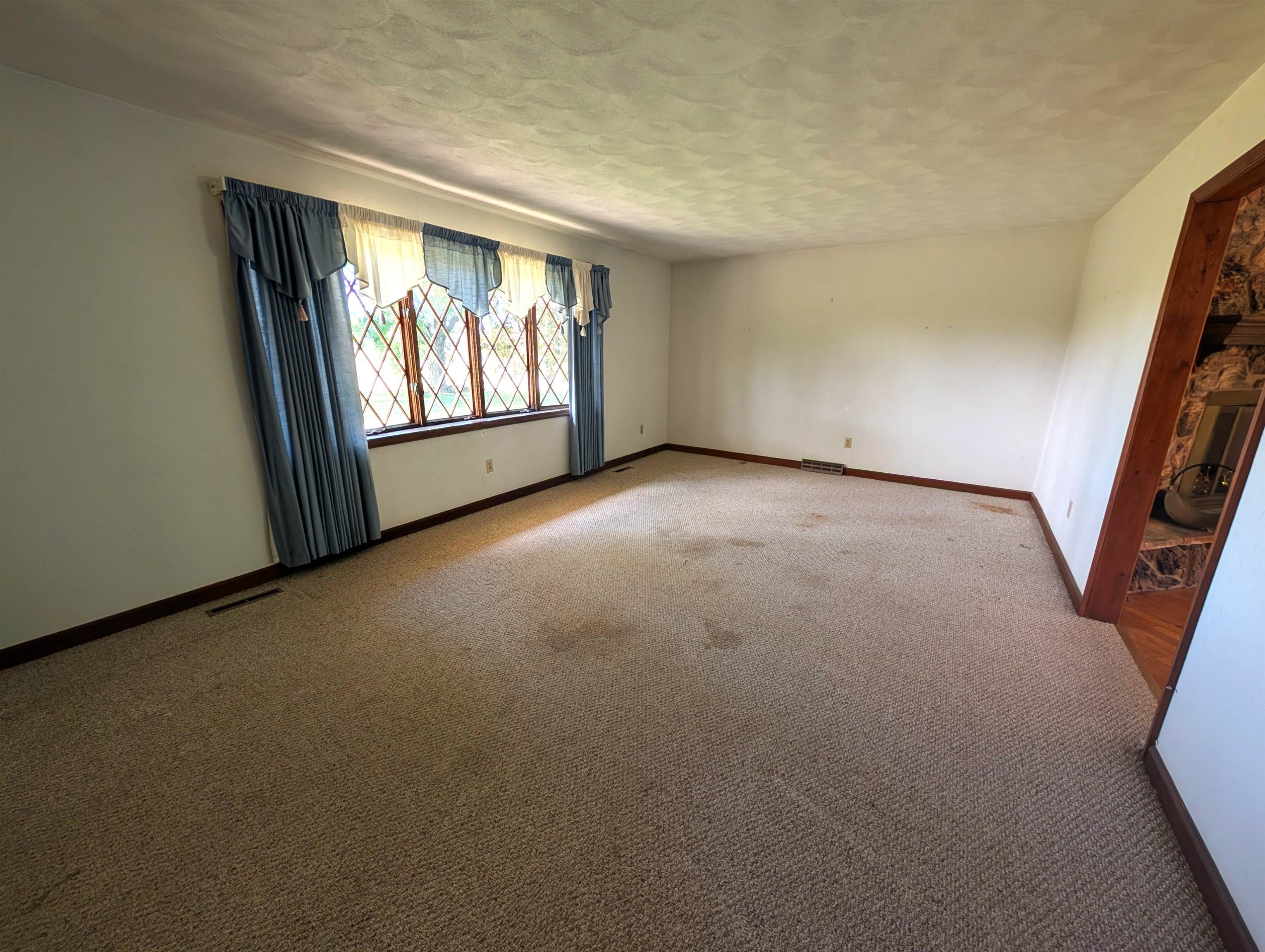 10740 North Barker Road Byron, IL 61010 - Photo 8 of 21 an empty room with windows