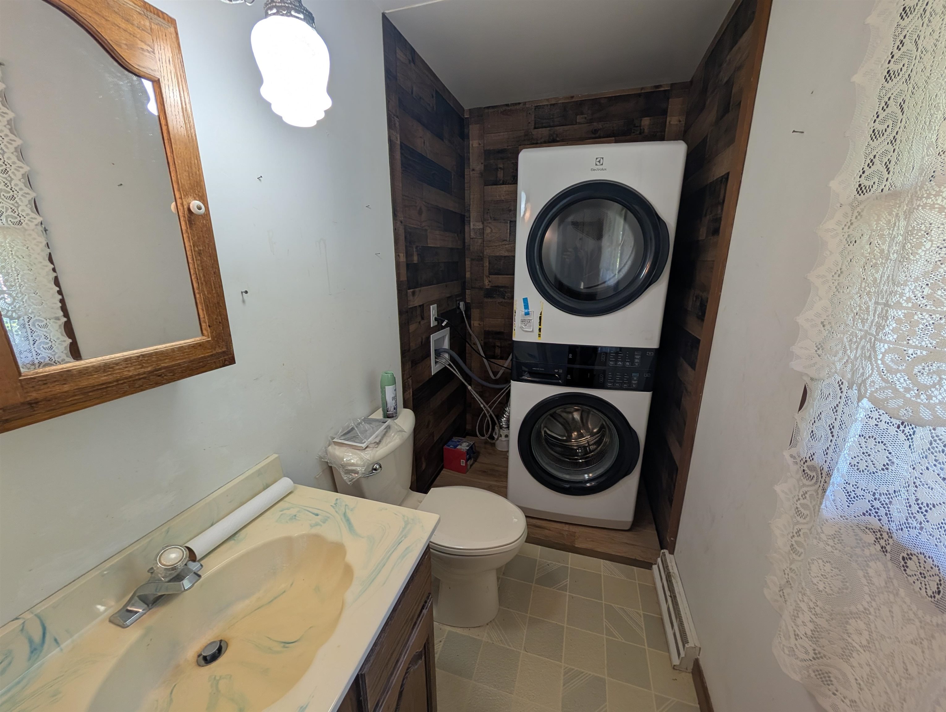 10740 North Barker Road Byron, IL 61010 - Photo 10 of 21 a bathroom with a sink a toilet and a mirror