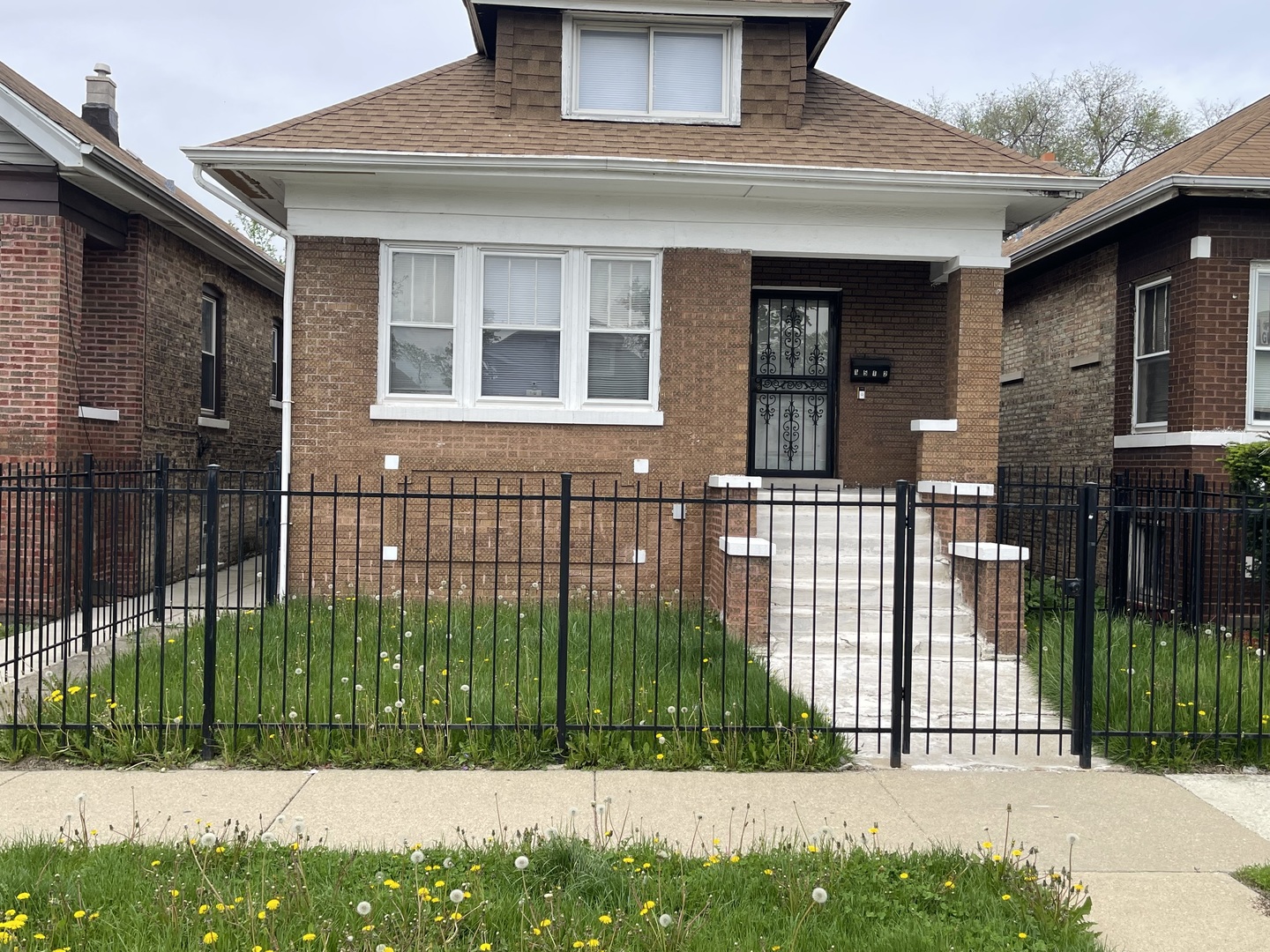 1512 North Linder Avenue Chicago, IL 60651 - Photo 1 of 19 a front view of a house