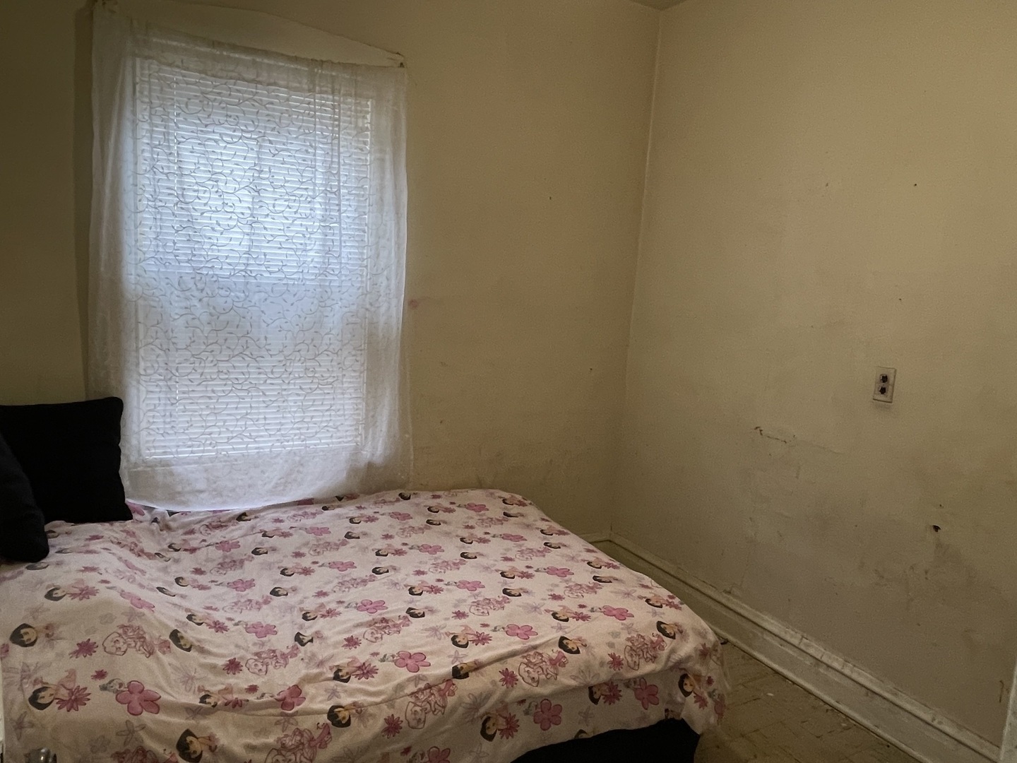 1512 North Linder Avenue Chicago, IL 60651 - Photo 12 of 19 a bedroom with a bed and a window