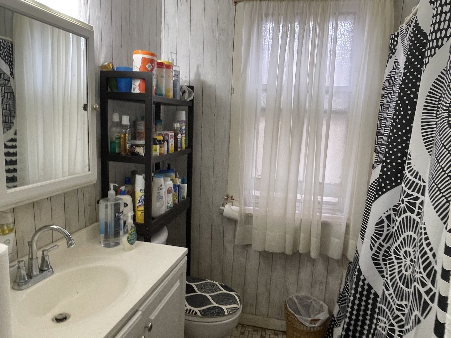 1512 North Linder Avenue Chicago, IL 60651 - Photo 15 of 19 a bathroom with a sink and a mirror