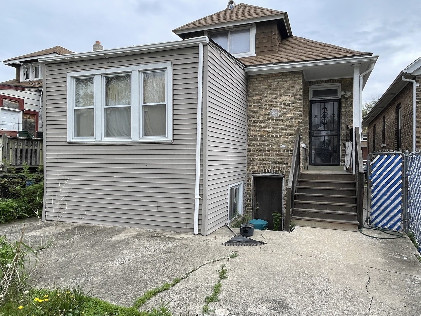 1512 North Linder Avenue Chicago, IL 60651 - Photo 19 of 19 a front view of a house with a yard and garage
