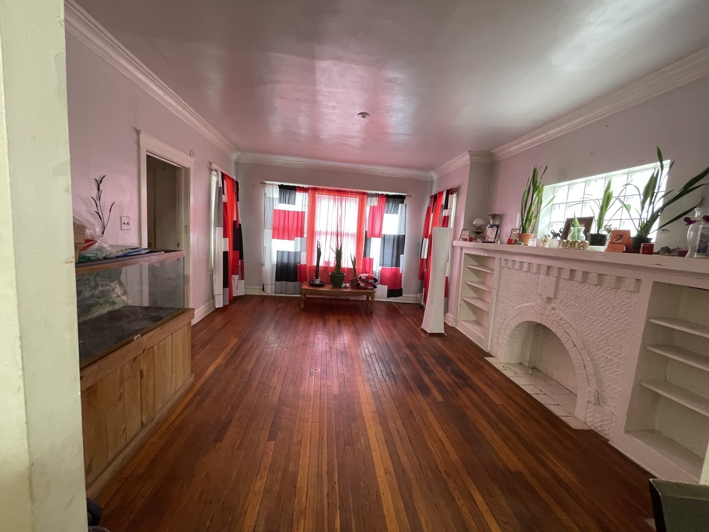 1512 North Linder Avenue Chicago, IL 60651 - Photo 7 of 19 a view of a livingroom with furniture hardwood floor and a ceiling fan