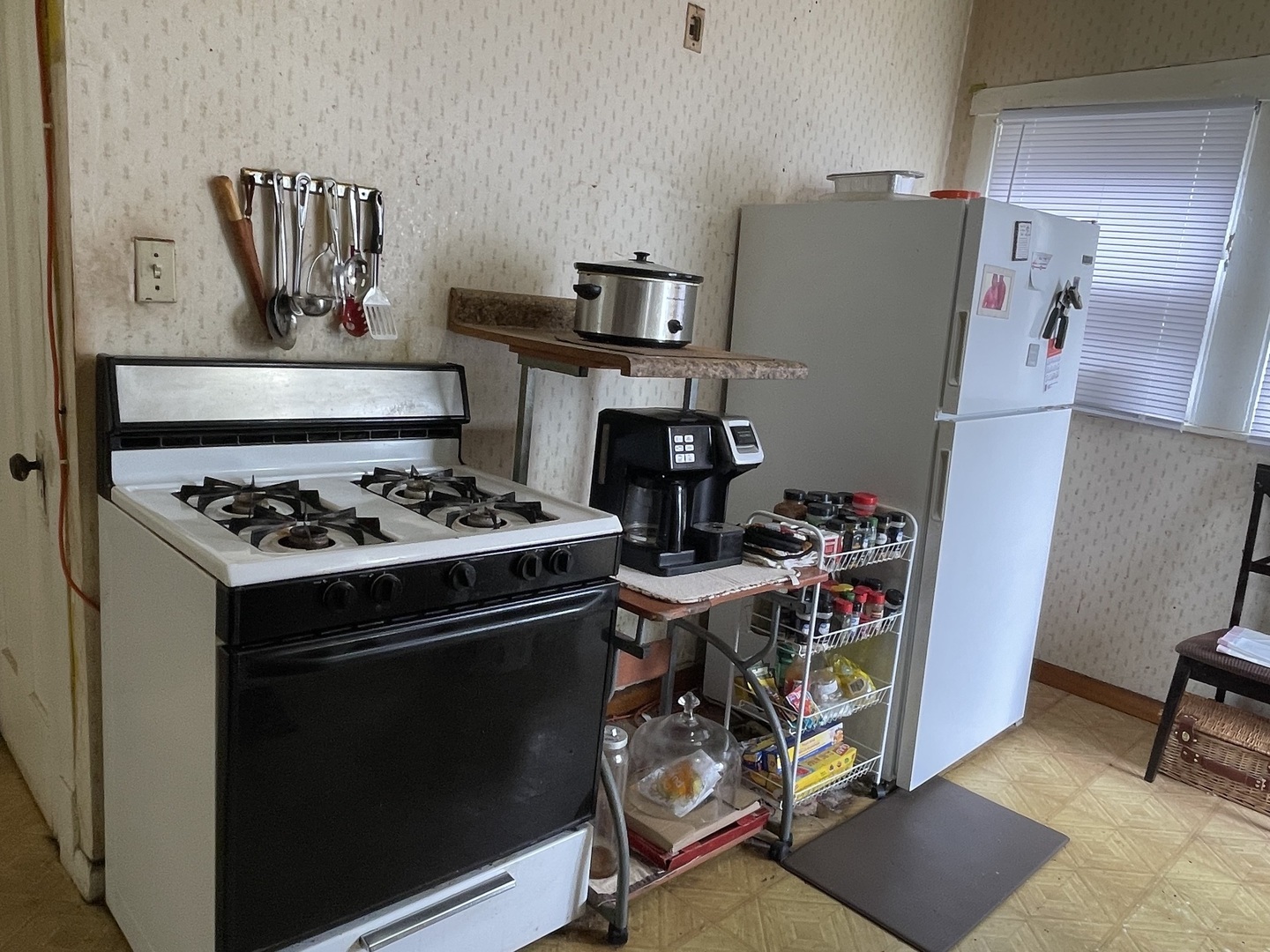 1512 North Linder Avenue Chicago, IL 60651 - Photo 9 of 19 a kitchen with a refrigerator and a stove