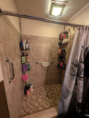 a room with gym equipment and a flat screen tv