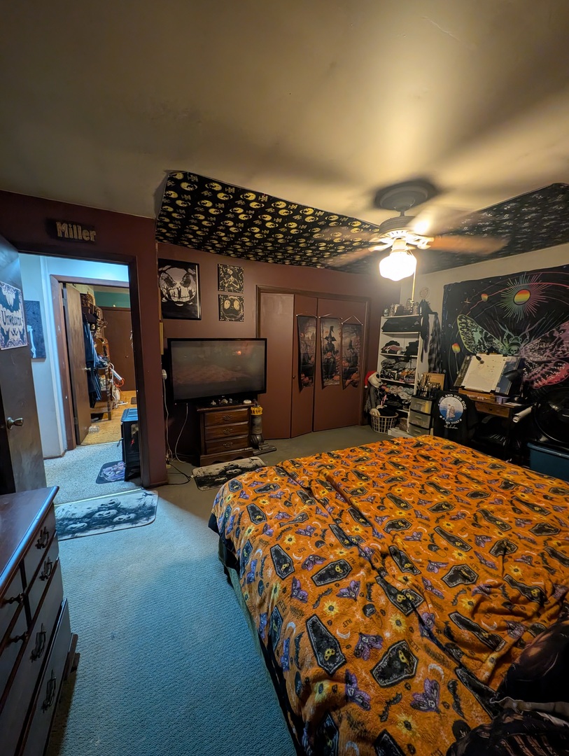 1824 Cobb Boulevard Kankakee, IL 60901 - Photo 13 of 30 a bedroom with a bed a mirror and dresser