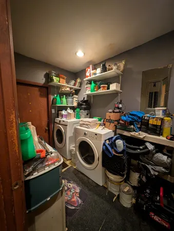 a bed room with a bed and a lamp