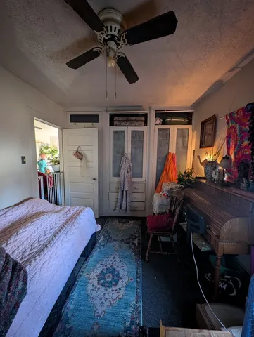 a bed room with a bed and a tv