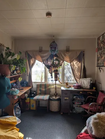 a kitchen with stove and cabinets