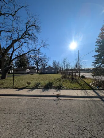 a view of a road with a yard
