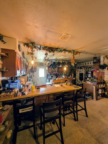 a area with lots of furniture and clutter