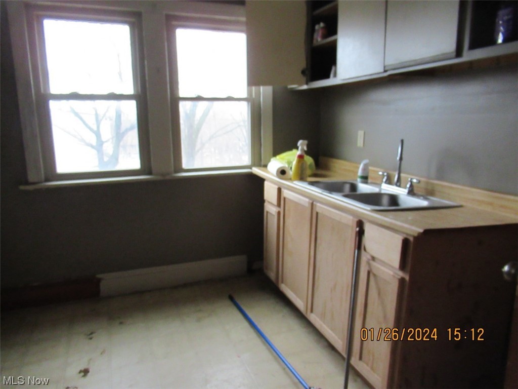 1823-1825 Reyburn Road Cleveland, OH 44112 - Photo 2 of 18 Kitchen featuring sink and a wealth of natural light