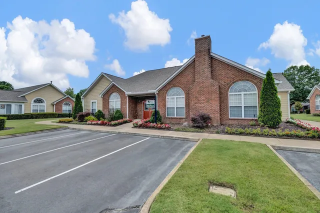 a view of house with a big yard