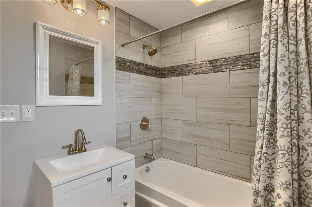 110 Oakville Road Beaver Falls, PA 15010 - Photo 34 of 48 An equally beautiful hall bathroom with a tub/shower combo.
