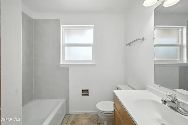 a bathroom with a sink toilet and bathtub