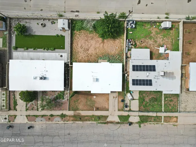 a picture of a building with a garden