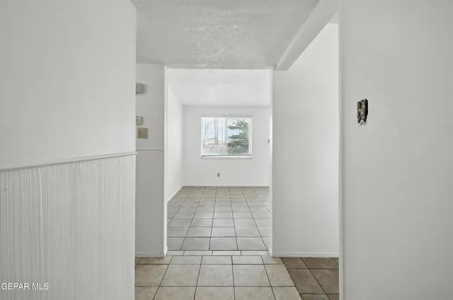 a view of an empty room and window