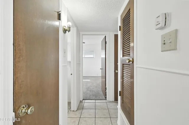 a bathroom with a glass door shower
