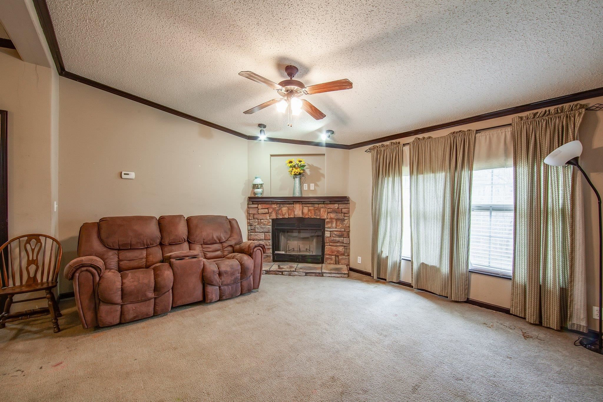 1040 River Road Bolivar, TN 38008 - Photo 14 of 27 a living room with furniture and a fireplace