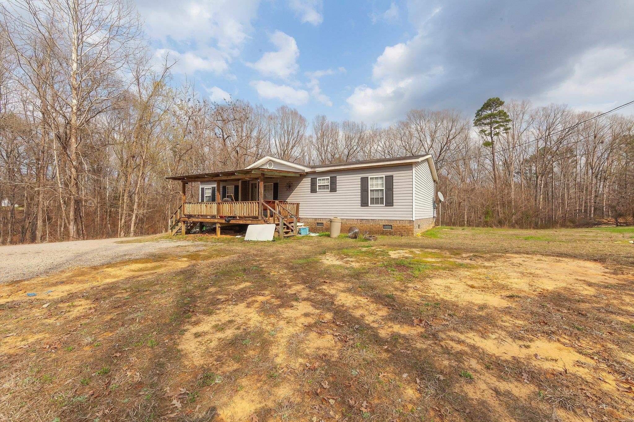1040 River Road Bolivar, TN 38008 - Photo 3 of 27 a front view of a house with a yard and large trees