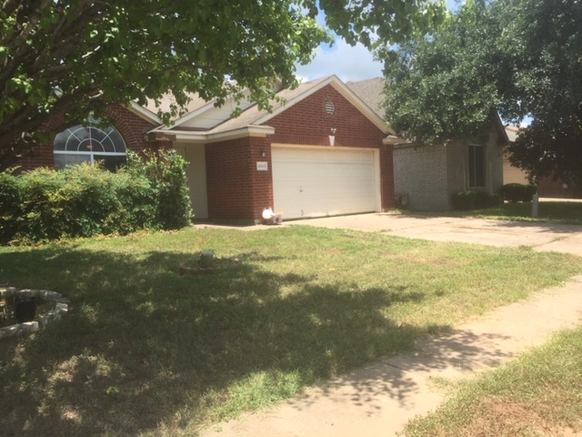 a house with yard in front of it