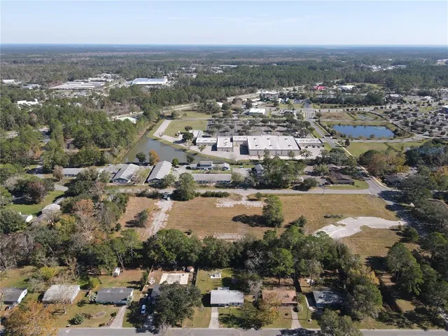 an aerial view of residential building with lake view