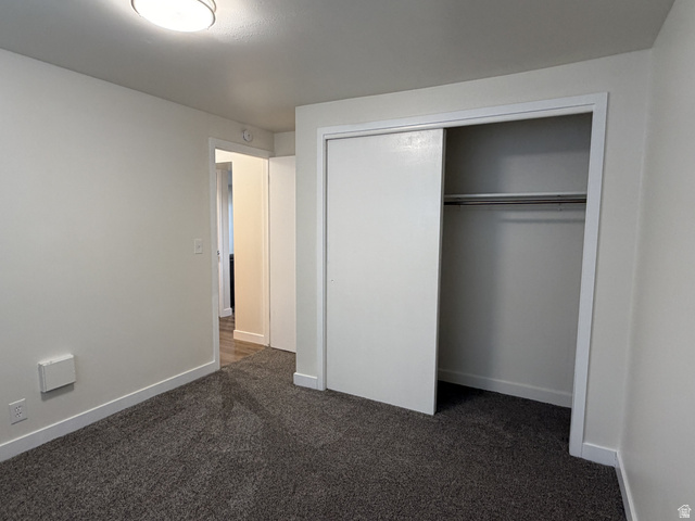 895 East Arrowhead Lane Murray, UT 84107 - Photo 8 of 12 Interior room featuring gray carpeting and white walls