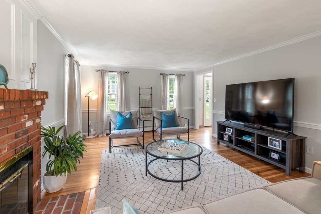 45 Eastside Road Wrentham, MA 02093 - Photo 5 of 35 a living room with furniture and a flat screen tv