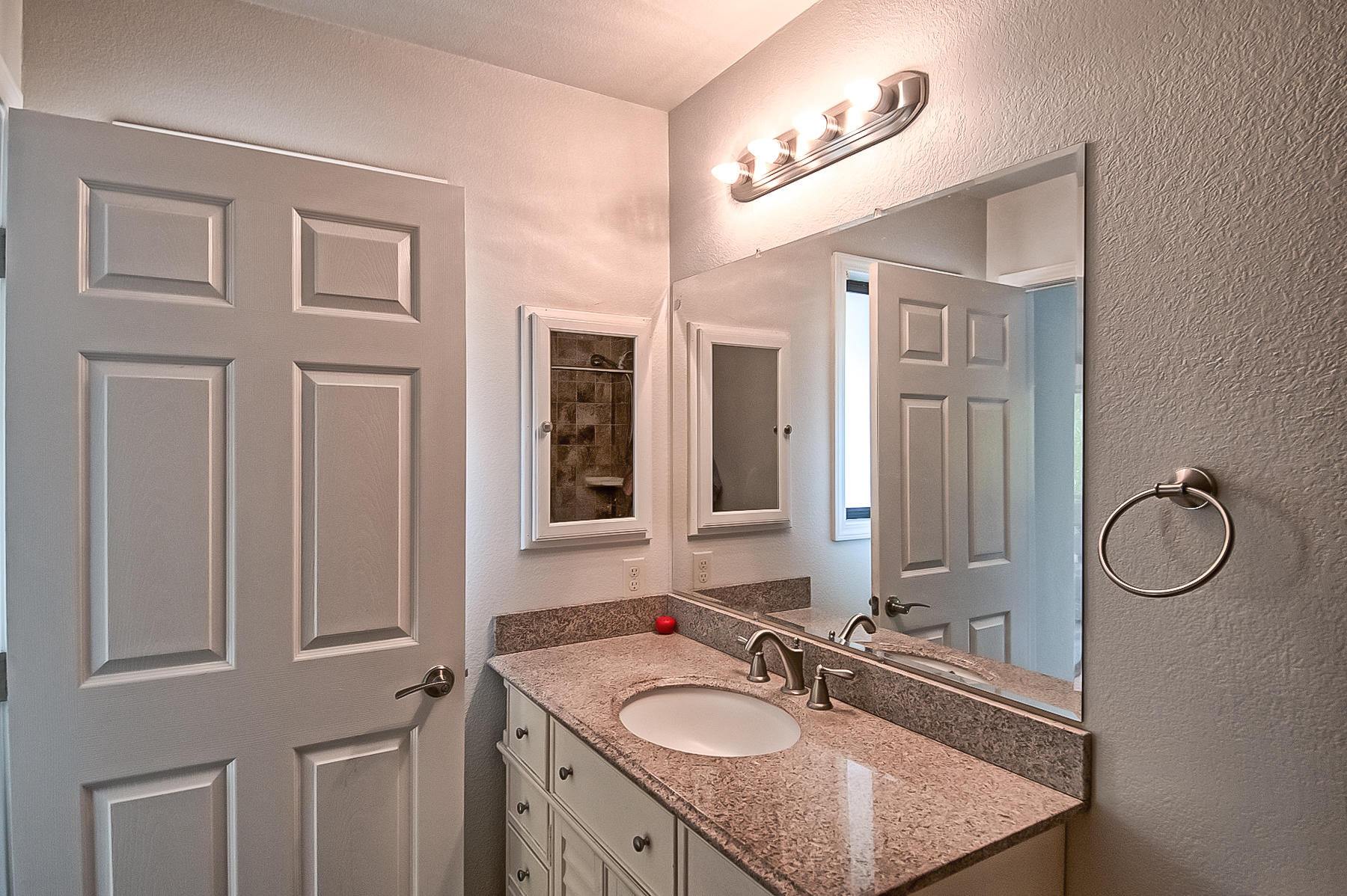 21310 Dersch Road Anderson, CA 96007 - Photo 21 of 35 a bathroom with a granite countertop double vanity sink mirror and