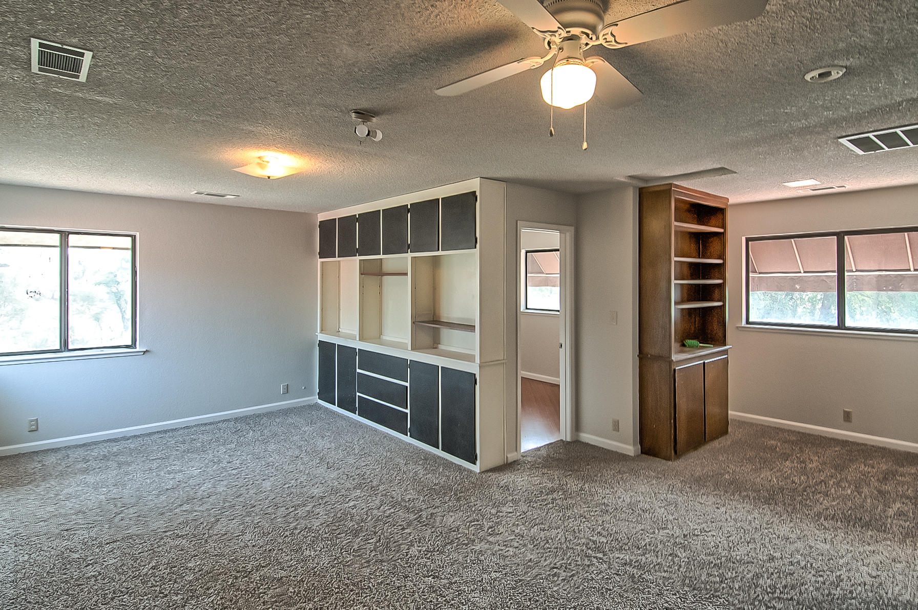 21310 Dersch Road Anderson, CA 96007 - Photo 29 of 35 an empty room with closet and chandelier fan