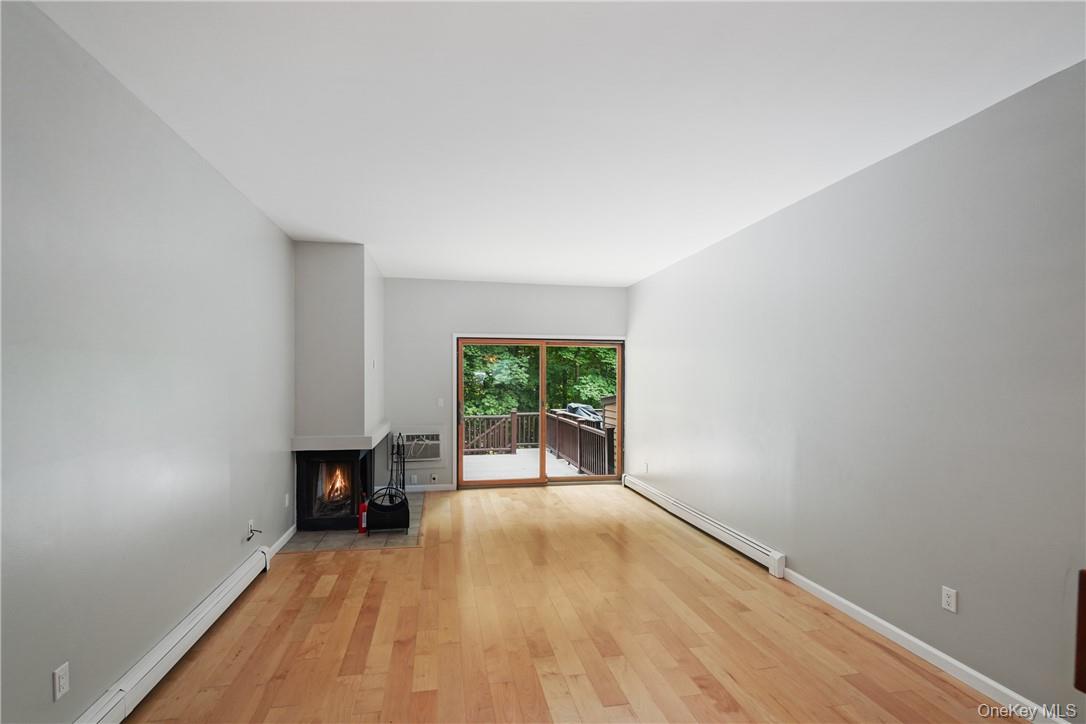 118 Round Hill Road Dobbs Ferry, NY 10522 - Photo 11 of 16 a view of empty room with wooden floor and fan